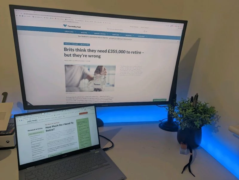 Regional Financial Advisor: Image caption: Tom Riley's desk during the financial advisor campaign. On the monitor, a Motley Fool article, Brits think they need £355,000 to retire. On the laptop, the client's How Much Do I Need To Retire guide, the kind of high intent retirement planning page the campaign was built around