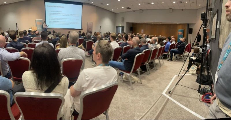 The packed main room at Affiliate Gathering York during a filmed talk