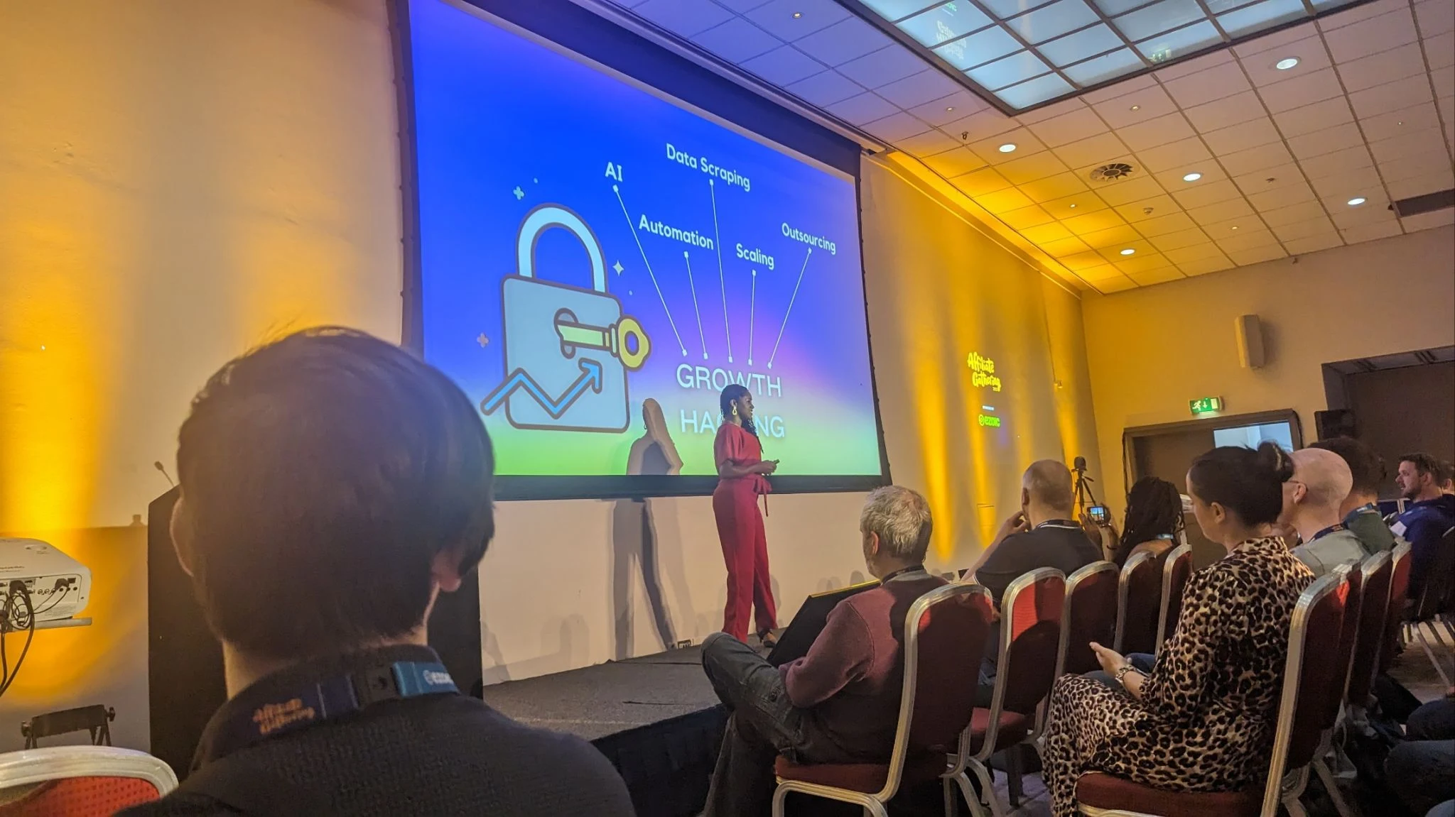 A growth hacking presentation on the main stage at Affiliate Gathering York covering AI, automation, data scraping, scaling and outsourcing
