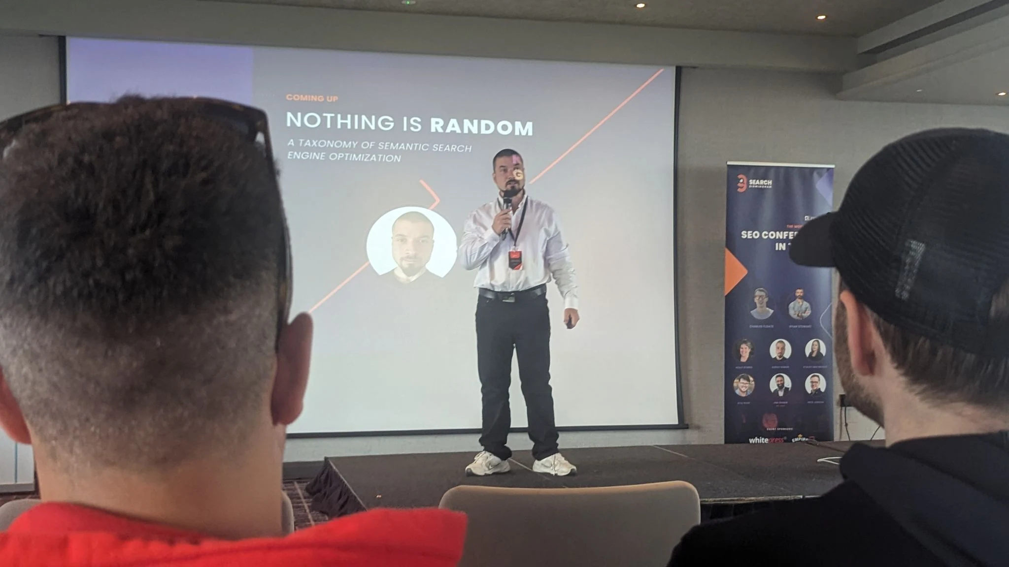 Koray Tugberk GUBUR presenting Nothing Is Random, A Taxonomy of Semantic Search Engine Optimization, on stage at Search Birmingham