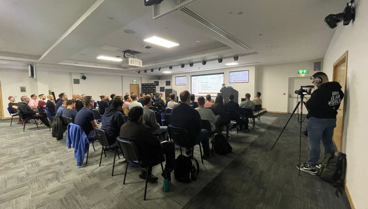 The main room at SEO Underground London, a full audience of SEOs watching a talk being filmed