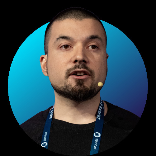 Koray Tuğberk Gübür, founder of Holistic SEO, speaking at SERP Conf
